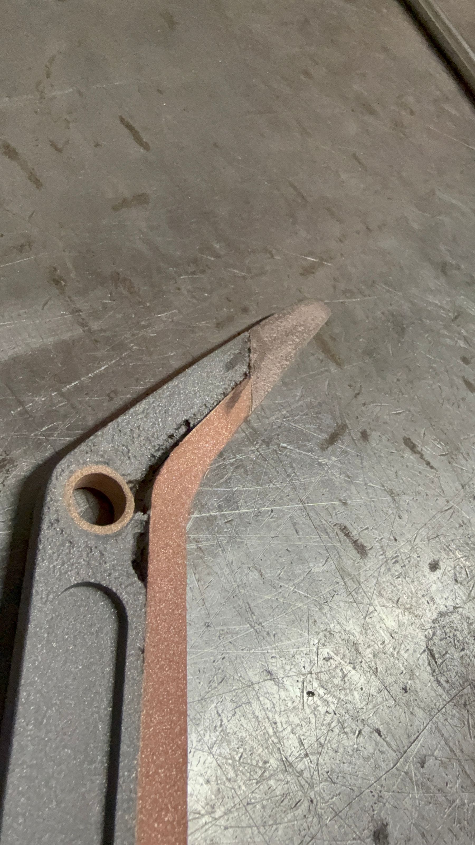 Close-up of copper cold spray coating applied to high voltage transfer arm