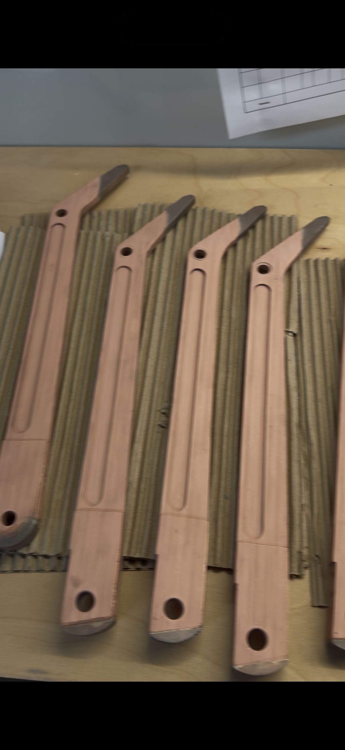 Detail view of copper cold spray finish on high voltage transfer arm surface