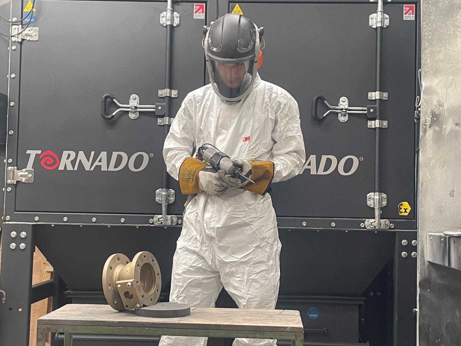 Cold spray technician at work in the workshop